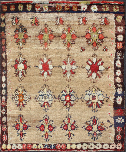 Angora Turkish Tulu Carpet with Colorful Floral Designs Set on Sand Field Angora Turkish Tulu Carpet Antique rug//en - 140522 origin/turkey kwarugs his Tulu carpet features several multicolored floral motifs laid across a sand - colored field... - Keivan Woven ArtsEN - 140522 - 6370Rug