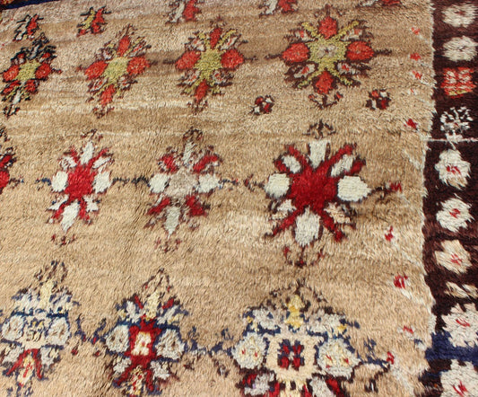 Angora Turkish Tulu Carpet with Colorful Floral Designs Set on Sand Field Angora Turkish Tulu Carpet Antique rug//en - 140522 origin/turkey kwarugs his Tulu carpet features several multicolored floral motifs laid across a sand - colored field... - Keivan Woven ArtsEN - 140522 - 6370Rug