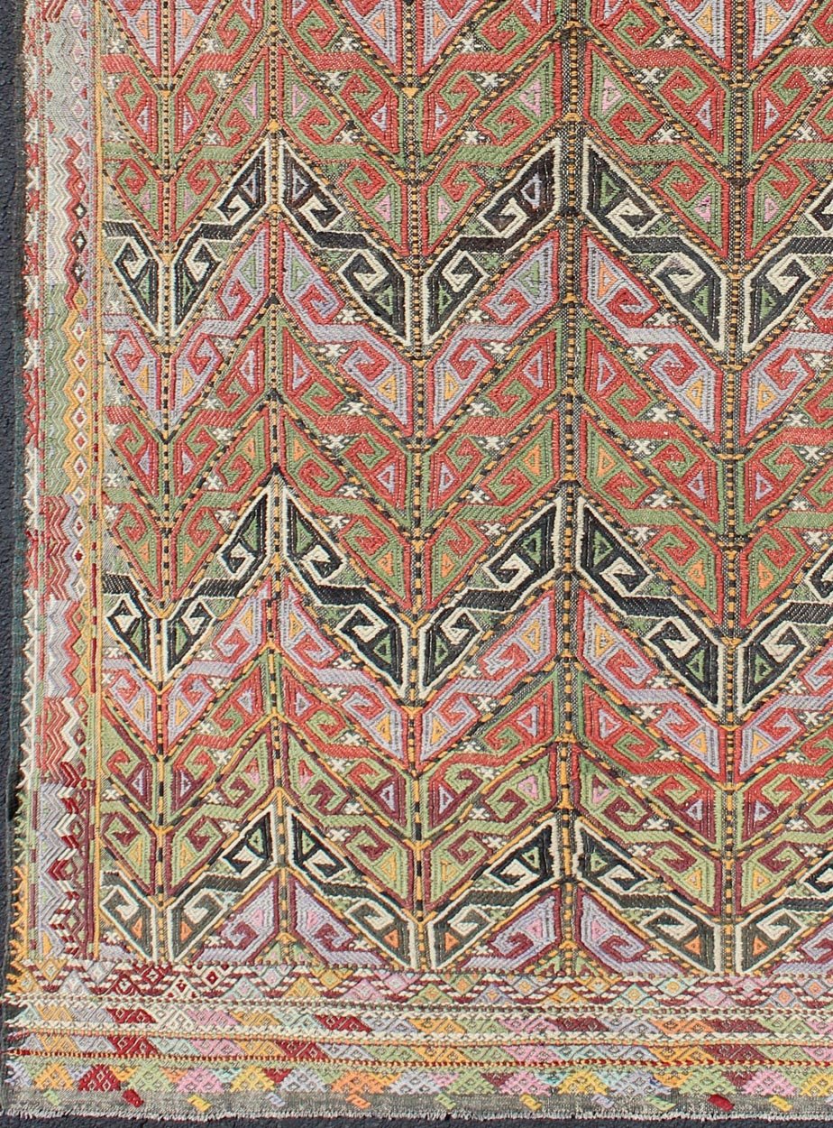 Vintage Embroidered Kilim Jajeem Rug Set on a multicolored background, this geometric Kilim Jajeem bears a large - scale repeating pattern. Colors include an array of gold, light green, pink, light blue, charcoal, red, yellow, orange and ivory. ... - Keivan Woven ArtsEN - 140532 - 6065Rug