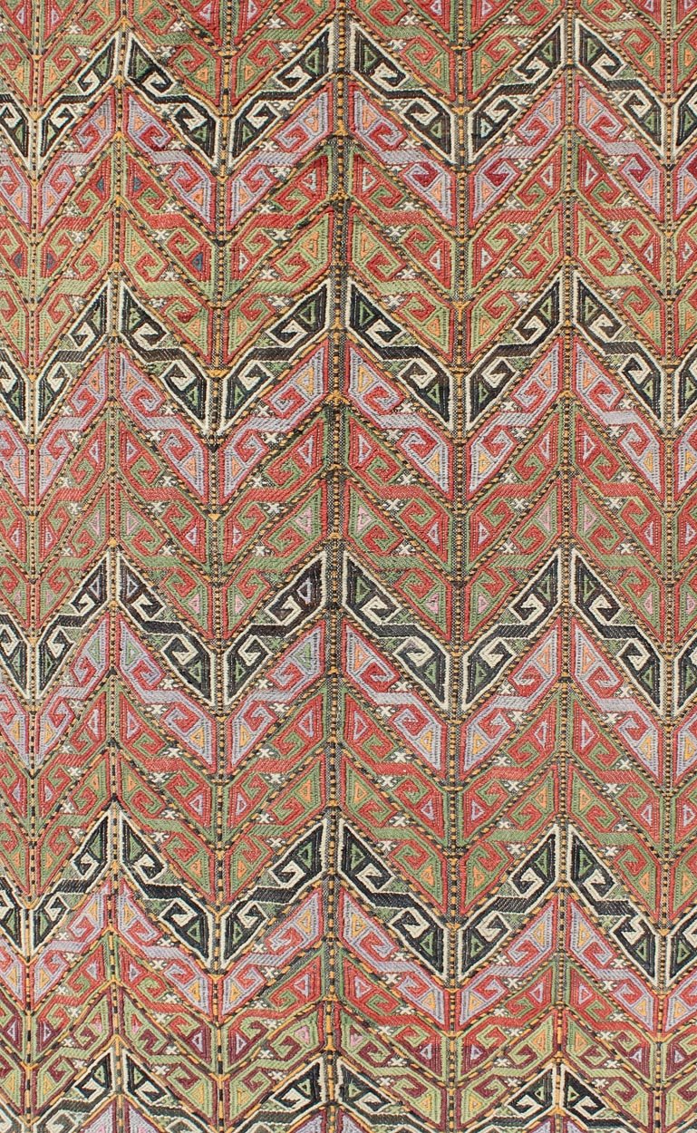 Vintage Embroidered Kilim Jajeem Rug Set on a multicolored background, this geometric Kilim Jajeem bears a large - scale repeating pattern. Colors include an array of gold, light green, pink, light blue, charcoal, red, yellow, orange and ivory. ... - Keivan Woven ArtsEN - 140532 - 6065Rug