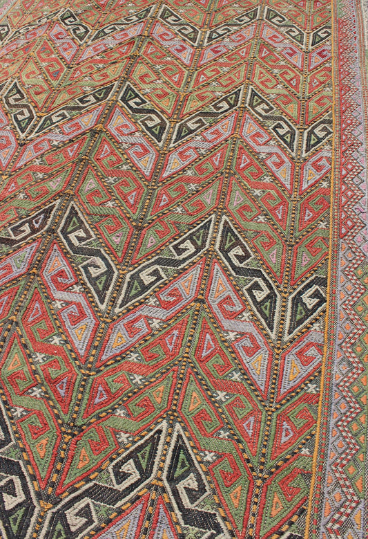 Vintage Embroidered Kilim Jajeem Rug Set on a multicolored background, this geometric Kilim Jajeem bears a large - scale repeating pattern. Colors include an array of gold, light green, pink, light blue, charcoal, red, yellow, orange and ivory. ... - Keivan Woven ArtsEN - 140532 - 6065Rug