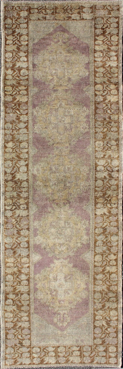 Vintage Oushak Runner This unique Turkish Oushak runner displays an elegant multi floral medallions which are complemented by a Sub geometric border. This rug has light purple background with dark brown, light blue, cream, green and taupe. Me... - Keivan Woven ArtsEN - 140539 - 6077Rug