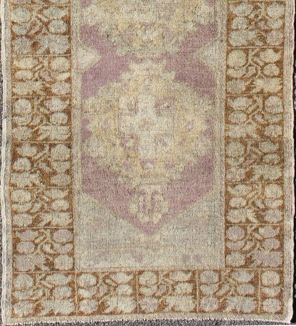 Vintage Oushak Runner This unique Turkish Oushak runner displays an elegant multi floral medallions which are complemented by a Sub geometric border. This rug has light purple background with dark brown, light blue, cream, green and taupe. Me... - Keivan Woven ArtsEN - 140539 - 6077Rug