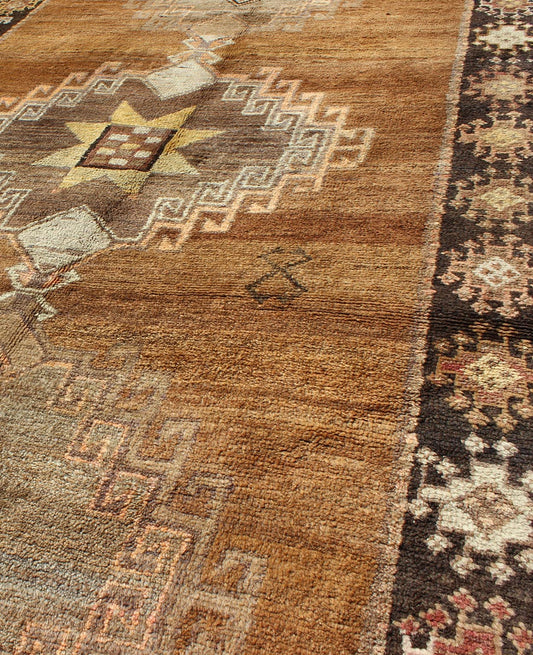Vintage Turkish Kars Tribal Medallion Runner in Camel, Brown, and Taupe Measures: 4'6 x 10'11 This Kars Oushak features a triple center medallion with an overall geometric design scheme. The camel colored background homes three large tri... - Keivan Woven ArtsEN - 140562 - 5684