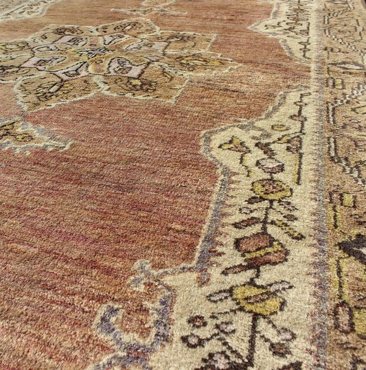 This vintage Turkish Oushak rug features an intricately beautiful design with a stylized floral aesthetic. The central medallion is surrounded by four cornices in the central field. The various shades of cream, yellow, charcoal, and gray blend beautifu... - Keivan Woven ArtsEN - 140587 - 6374Rug