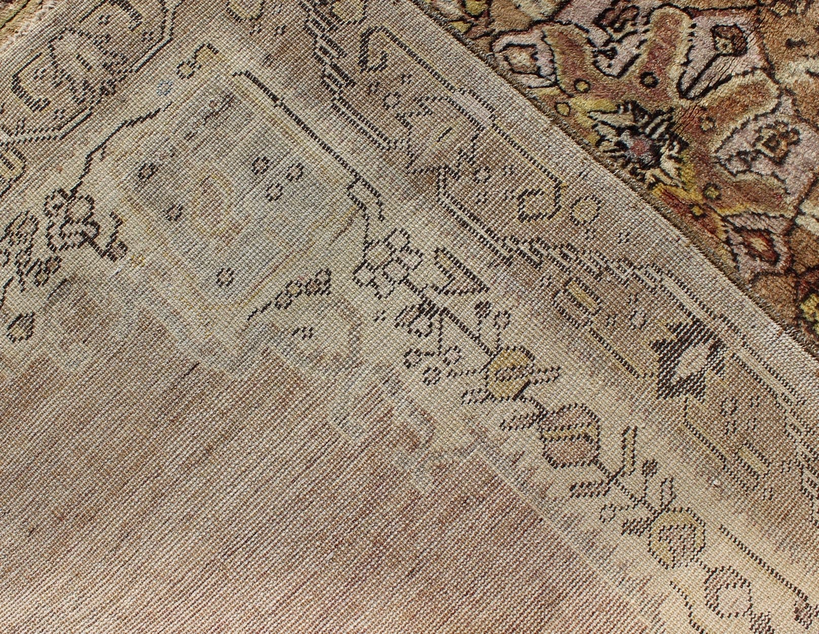 This vintage Turkish Oushak rug features an intricately beautiful design with a stylized floral aesthetic. The central medallion is surrounded by four cornices in the central field. The various shades of cream, yellow, charcoal, and gray blend beautifu... - Keivan Woven ArtsEN - 140587 - 6374Rug