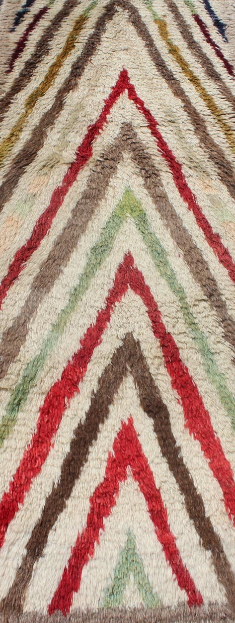 Vintage Turkish Tulu Runner with Tribal Design in Cream, Green, Red and Brown. Vintage Turkish Tulu Runner with Tribal Design. Keivan Woven Arts / rug EN - 140718, country of origin / type: Turkey / Tulu, circa 1940. This Tulu runner contai... - Keivan Woven ArtsEN - 140718 - 6009Rug