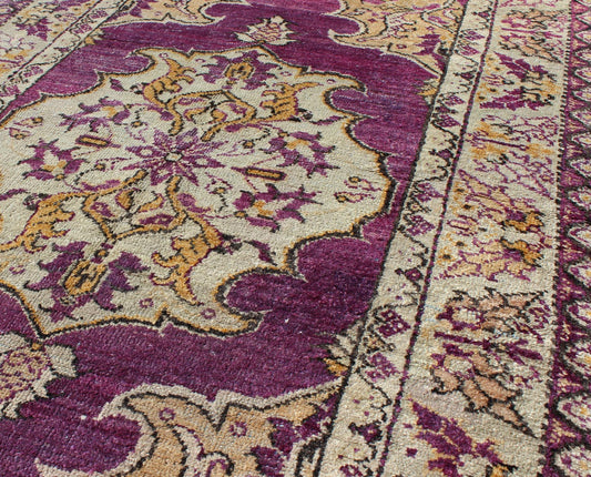 Purple Vintage Turkish Oushak Rug with a Traditional Medallion Design Measures: 3'6'' x 5'8''. This lovely vintage Oushak is set on a purple background and features a floral medallion with accents of deep gold. The taupe border has a unique ... - Keivan Woven ArtsEN - 141034 - 7135Rug