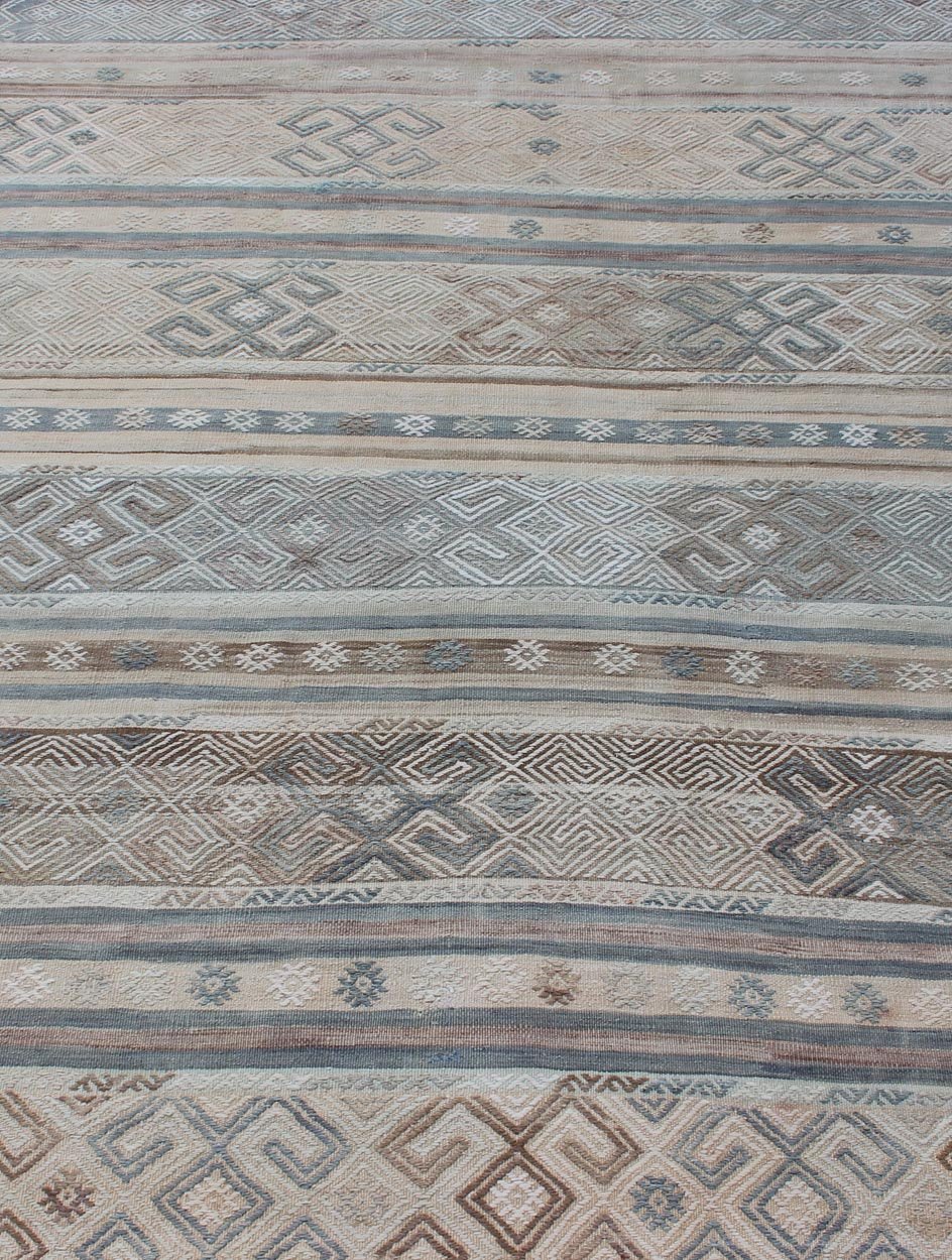 Measures: 5'9 x 7'7. This flat - woven Kilim runner from Turkey features an enticing composition consisting of stripes with fascinating geometric designs rendered in natural tones of brown and gray, as well as some blue shades. Vintage Kil... - Keivan Woven ArtsEN - 141087 - 11177Rug