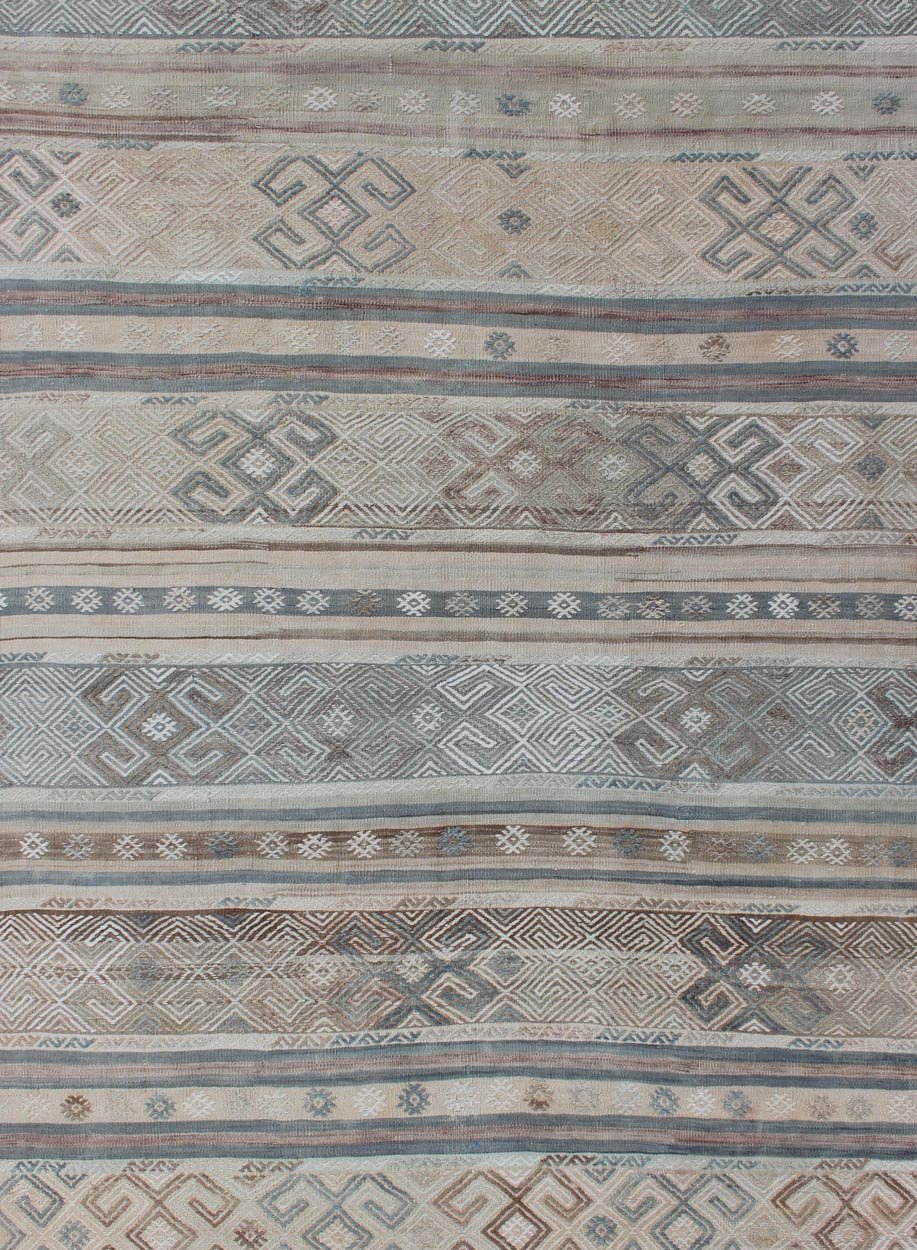 Measures: 5'9 x 7'7. This flat - woven Kilim runner from Turkey features an enticing composition consisting of stripes with fascinating geometric designs rendered in natural tones of brown and gray, as well as some blue shades. Vintage Kil... - Keivan Woven ArtsEN - 141087 - 11177Rug
