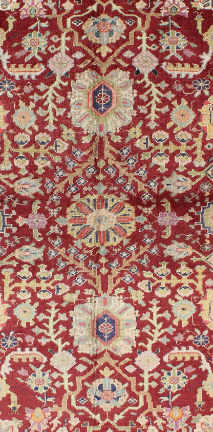 Colorful Turkish Oushak Carpet with Scattered Vines and Flowers on a Red Field Oushak Carpet with Scattered Vines and Flowers on a Red Field rug/en - 141107 origin/ turkey kwarugs Handwoven in Turkey, this antique Oushak rug features scatte... - Keivan Woven ArtsEN - 141107 - 7145Rug