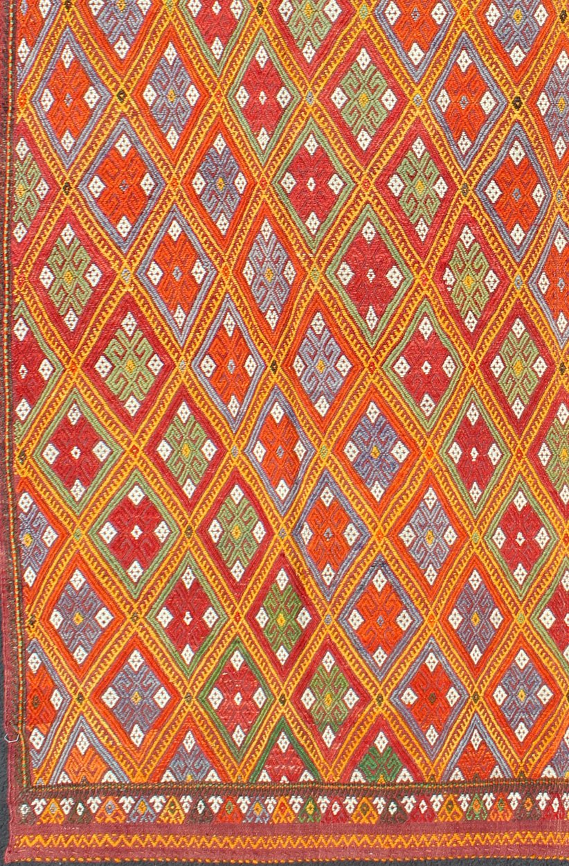 Vintage Turkish Embroidered Jijim Kilim With All - Over Diamond Design in Bright Colors Measures: 5'6'' x 9'0''. Featuring tribal diamond shapes with a spotted and speckled assortment of geometric elements, this finely woven embroidered Jijim s... - Keivan Woven ArtsEN - 141111 - 7149Rug