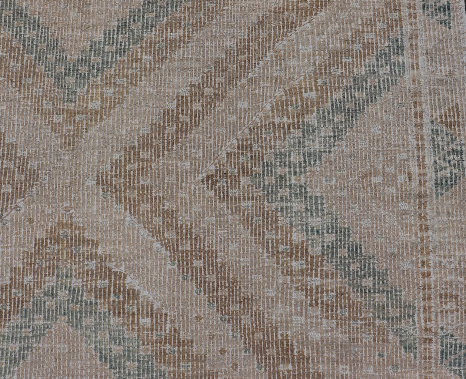 Vintage Hand - Woven Turkish Gallery Kilim Rug in Wool with Diamond Design This flat - weave tribal Turkish kilim has been hand - woven in wool. The rug features an all - over sub - geometric diamond design, and is rendered in blue and earthy tones; maki... - Keivan Woven ArtsEN - 141120 - 19838