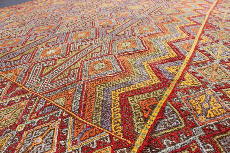 Large Vintage Turkish Embroidered Kilim in Bright and Colorful Tones Measures: 7'4'' x 10'11''. Featuring tribal shapes with a spotted and speckled assortment of geometric elements, this unique Jajeem / Jejim showcases an array of rich color... - Keivan Woven ArtsEN - 141128 - 7155Rug