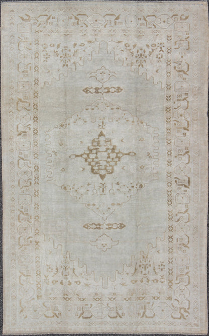 Vintage Turkish Oushak Rug with Large Central Medallion in Neutral Tones Measures: 7'3'' x 11'2''. This vintage Oushak carpet beautifully integrates neutral color compositions to decorate a calm and serene room with a subtle geometric medalli... - Keivan Woven ArtsEN - 141639 - 7831Rug