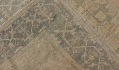 Medallion Vintage Turkish Oushak Rug in Taupe, Green and Sand Colors This vintage Turkish Oushak rug (circa mid - 20th century) features a unique blend of colors and an intricately beautiful design. The central three medallions, two more faint tha... - Keivan Woven ArtsEN - 141655 - 6710Rug