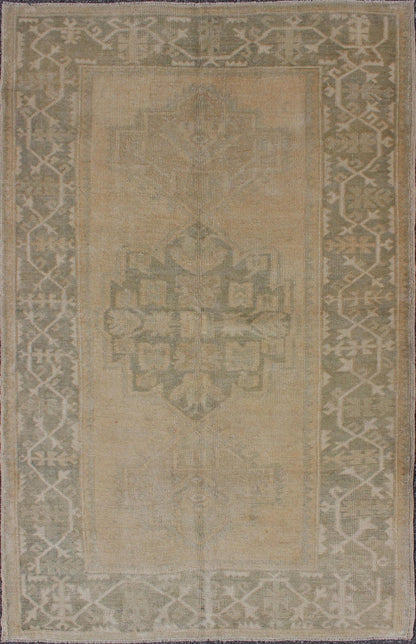 Medallion Vintage Turkish Oushak Rug in Taupe, Green and Sand Colors This vintage Turkish Oushak rug (circa mid - 20th century) features a unique blend of colors and an intricately beautiful design. The central three medallions, two more faint tha... - Keivan Woven ArtsEN - 141655 - 6710Rug