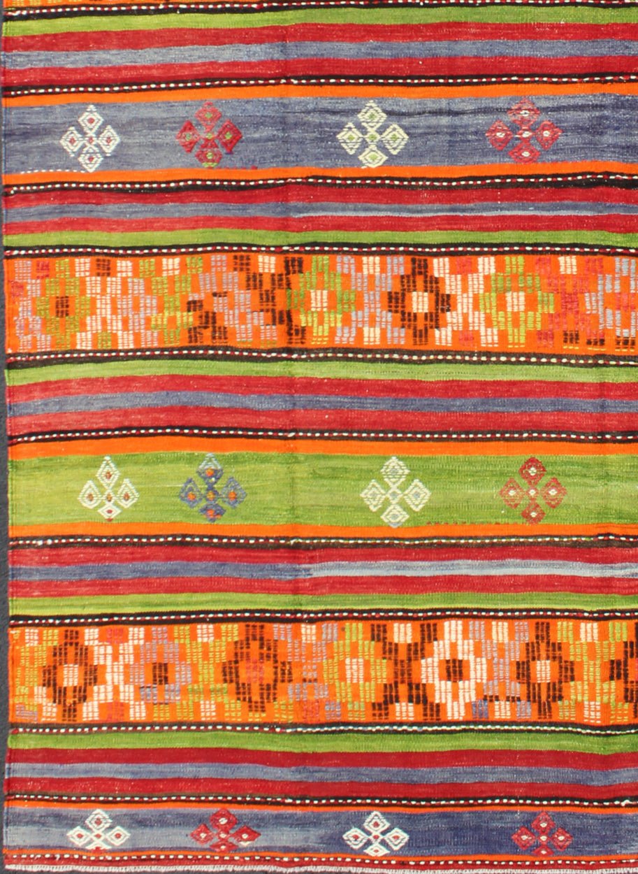 Colorful and Bright Turkish Kilim Rug with Stripe Geometric Design. Vintage Hand - Knotted Turkish Kilim, rug EN - 141719, country of origin / type: Turkey / Kilim, circa mid - 20th century. Featuring tribal shapes with a spotted and speckled asso... - Keivan Woven ArtsEN - 141719 - 6757Rug