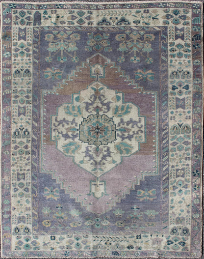 Purple and Teal Vintage Turkish Oushak Rug with Floral Layered Medallion Design Measures: 5'0 x 6'6''. This vintage Turkish Oushak rug features an intricately beautiful design with a floral aesthetic. The central medallion is surrounded by mu... - Keivan Woven ArtsEN - 141744 - 6769Rug