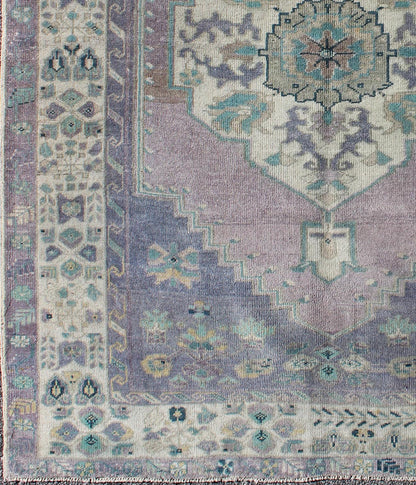 Purple and Teal Vintage Turkish Oushak Rug with Floral Layered Medallion Design Measures: 5'0 x 6'6''. This vintage Turkish Oushak rug features an intricately beautiful design with a floral aesthetic. The central medallion is surrounded by mu... - Keivan Woven ArtsEN - 141744 - 6769Rug