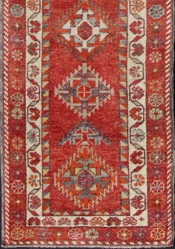 Vintage Turkish Oushak Runner with Medallions in Rust Red and Multi Colors Measures: 2'7'' x 11'6''. This Oushak runner from mid - 20th century Turkey features an all - over multi - medallion design rendered in geometric patterns and a wide variety... - Keivan Woven ArtsEN - 141745 - 7715Rug