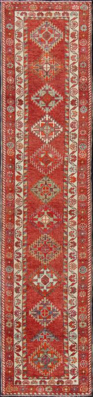 Vintage Turkish Oushak Runner with Medallions in Rust Red and Multi Colors Measures: 2'7'' x 11'6''. This Oushak runner from mid - 20th century Turkey features an all - over multi - medallion design rendered in geometric patterns and a wide variety... - Keivan Woven ArtsEN - 141745 - 7715Rug