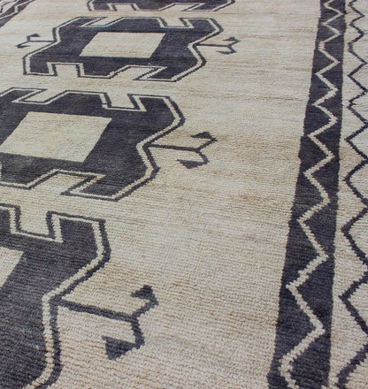 Midcentury Turkish Tulu Rug with Tribal Design in Purple/Gray and Cream Measures: 4'11 x 9'8 Turkish Tulu rug with tribal medallion design and cream in deep Purple/Gray and ivory. Tribaldesign Tulu rug with tribal design. Keivan Wo... - Keivan Woven ArtsEN - 141883 - 9412Rug