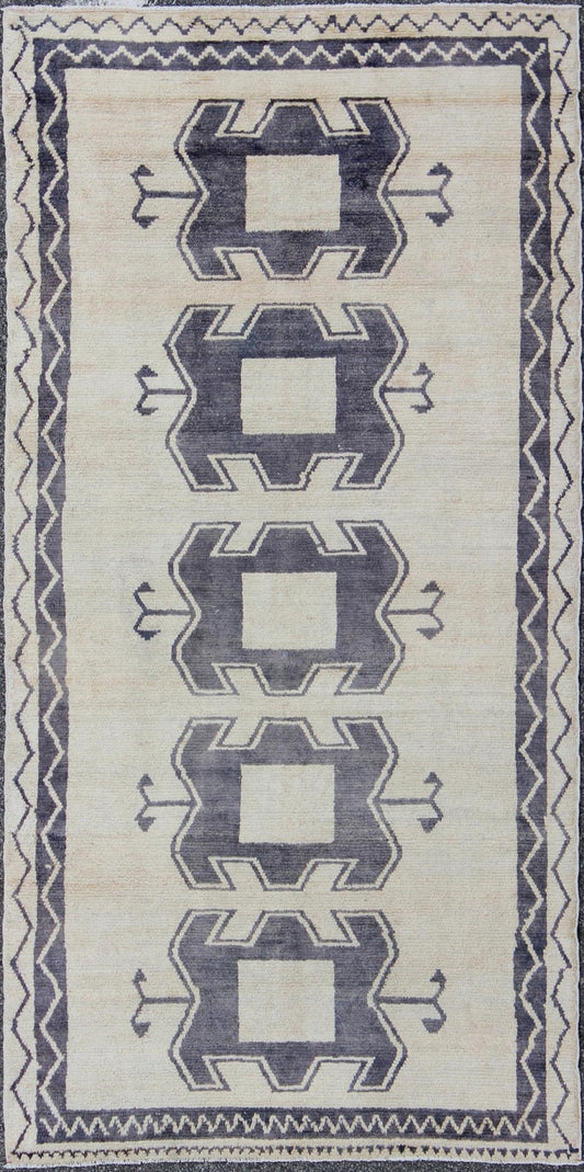 Midcentury Turkish Tulu Rug with Tribal Design in Purple/Gray and Cream Measures: 4'11 x 9'8 Turkish Tulu rug with tribal medallion design and cream in deep Purple/Gray and ivory. Tribaldesign Tulu rug with tribal design. Keivan Wo... - Keivan Woven ArtsEN - 141883 - 9412Rug