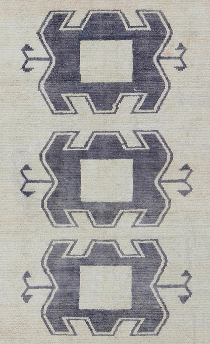 Midcentury Turkish Tulu Rug with Tribal Design in Purple/Gray and Cream Measures: 4'11 x 9'8 Turkish Tulu rug with tribal medallion design and cream in deep Purple/Gray and ivory. Tribaldesign Tulu rug with tribal design. Keivan Wo... - Keivan Woven ArtsEN - 141883 - 9412Rug