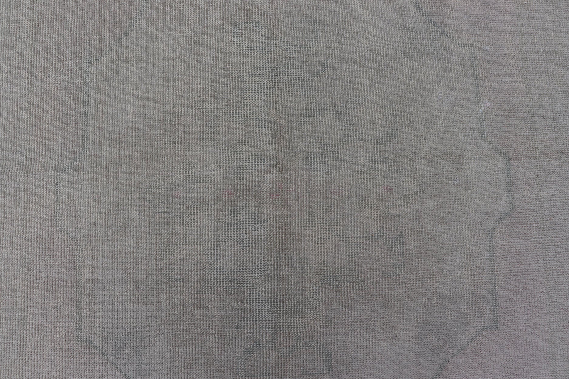 Vintage Turkish Medallion Oushak with All - Over Muted Tones of Neutral Colors Measures 4'5 x 7'0 The taupe - sandy color field homes a muted central medallion decorated in muted blue and pink. Tones of faded light green can be found within... - Keivan Woven ArtsEN - 142089 - 10940Rug