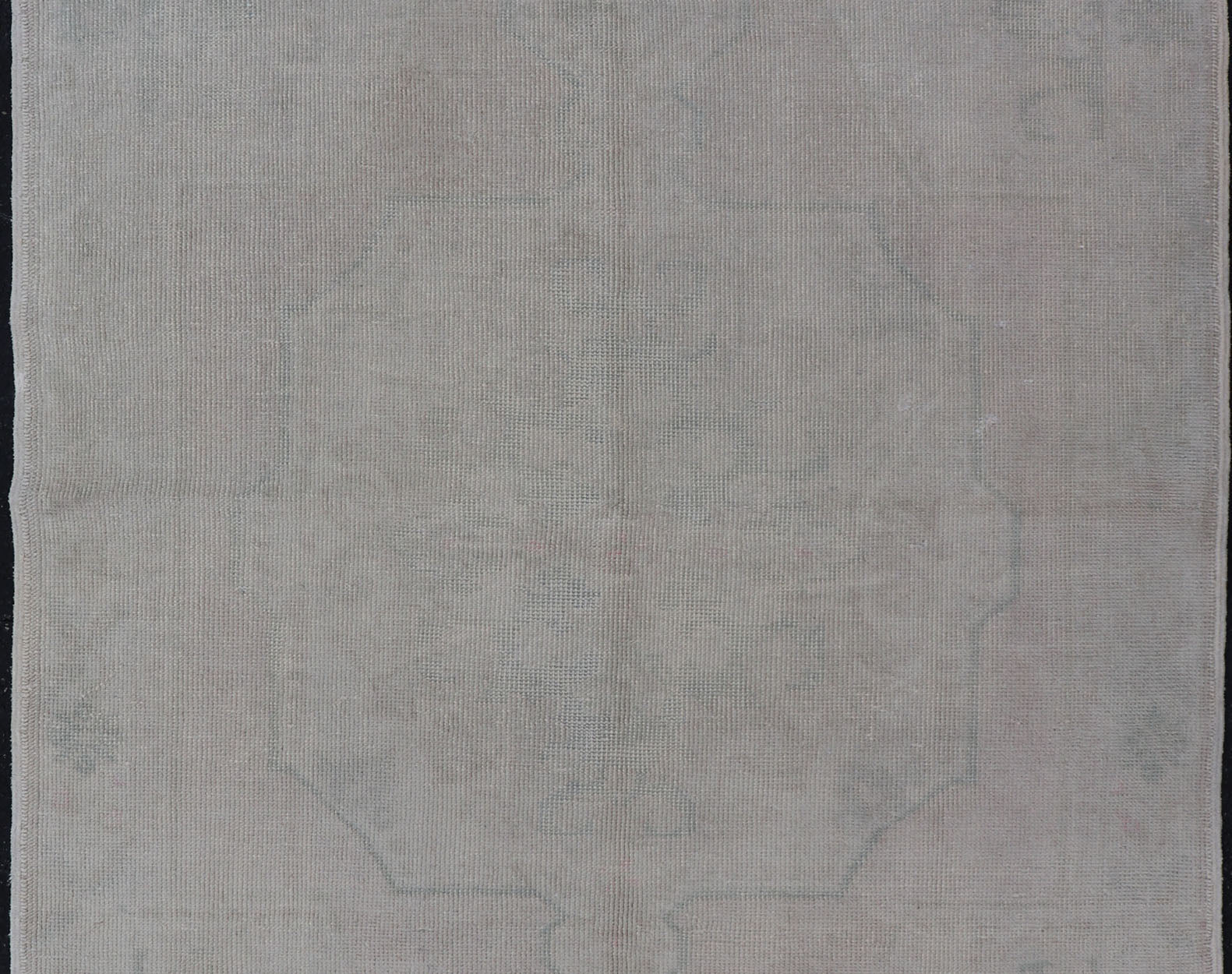 Vintage Turkish Medallion Oushak with All - Over Muted Tones of Neutral Colors Measures 4'5 x 7'0 The taupe - sandy color field homes a muted central medallion decorated in muted blue and pink. Tones of faded light green can be found within... - Keivan Woven ArtsEN - 142089 - 10940Rug