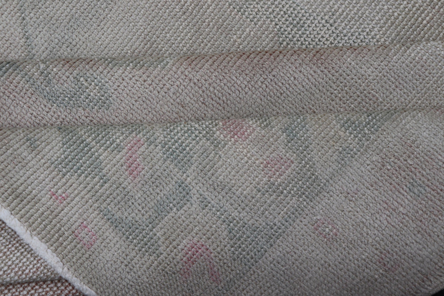 Vintage Turkish Medallion Oushak with All - Over Muted Tones of Neutral Colors Measures 4'5 x 7'0 The taupe - sandy color field homes a muted central medallion decorated in muted blue and pink. Tones of faded light green can be found within... - Keivan Woven ArtsEN - 142089 - 10940Rug