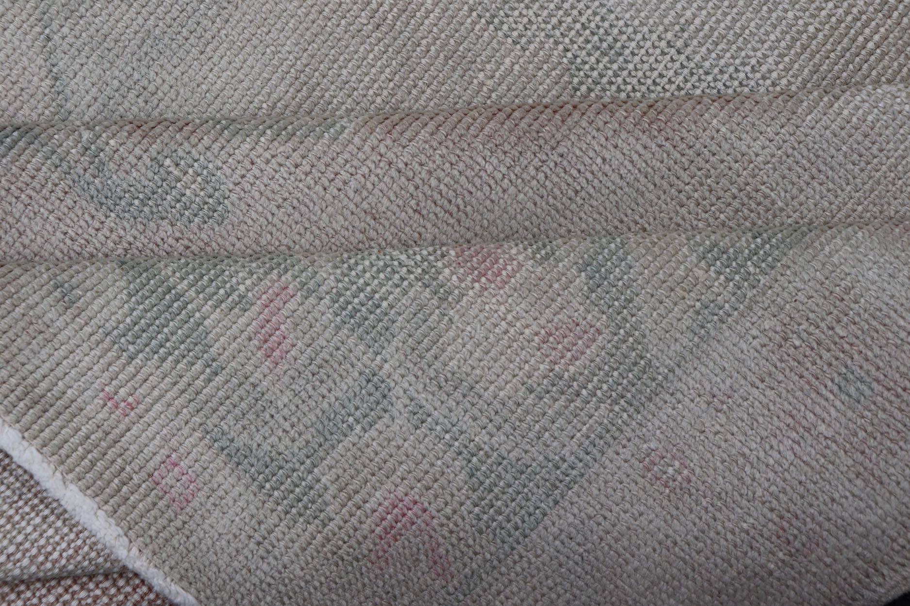 Vintage Turkish Medallion Oushak with All - Over Muted Tones of Neutral Colors Measures 4'5 x 7'0 The taupe - sandy color field homes a muted central medallion decorated in muted blue and pink. Tones of faded light green can be found within... - Keivan Woven ArtsEN - 142089 - 10940Rug