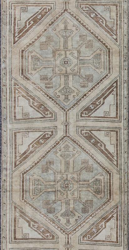 Vintage Turkish Oushak Runner with Ornate Cross Medallions Measures: 2'11'' x 13'3''. This compelling and unique Oushak runner was made in the mid - 20th century in Turkey. Characterized by a comely and highly representative Oushak composition,... - Keivan Woven ArtsEN - 142365 - 7851Rug