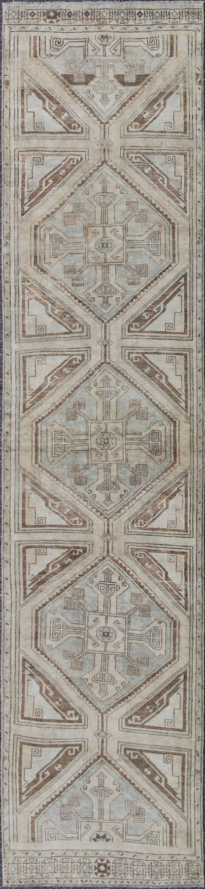 Vintage Turkish Oushak Runner with Ornate Cross Medallions Measures: 2'11'' x 13'3''. This compelling and unique Oushak runner was made in the mid - 20th century in Turkey. Characterized by a comely and highly representative Oushak composition,... - Keivan Woven ArtsEN - 142365 - 7851Rug