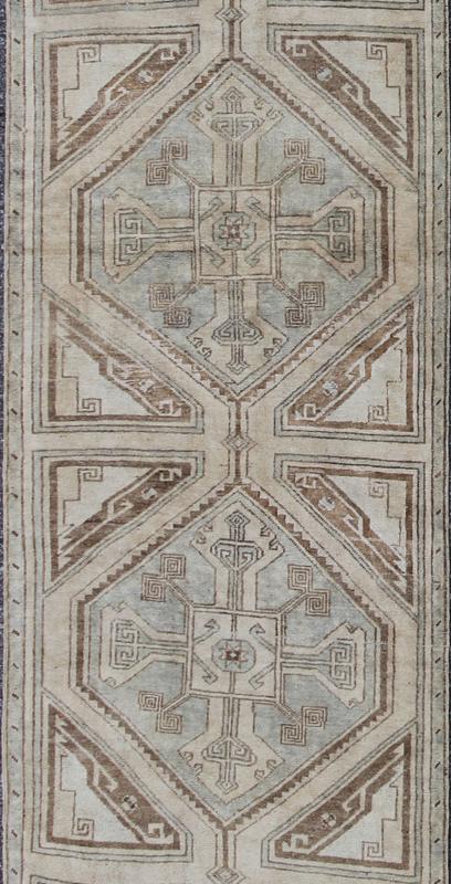 Vintage Turkish Oushak Runner with Ornate Cross Medallions Measures: 2'11'' x 13'3''. This compelling and unique Oushak runner was made in the mid - 20th century in Turkey. Characterized by a comely and highly representative Oushak composition,... - Keivan Woven ArtsEN - 142365 - 7851Rug