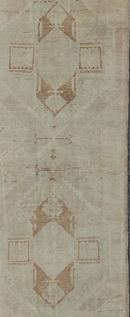 Vintage Oushak Turkish Runner with Ivory, Taupe and Light Brown and Faint Green Measures: 3'4'' x 11'8''. This beautiful vintage Oushak runner from mid - 20th century Turkey features a classic geometric Oushak design. The faint ivory groun... - Keivan Woven ArtsEN - 142367 - 8052Rug