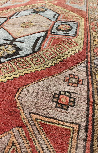 Vintage Turkish Hand Knotted Oushak Long Gallery Rug With Two Tribal Medallions The various shades of red pair elegantly with the bold tones of light blue, yellow and charcoal, laid out over two large tribal medallions with motifs in the field.... - Keivan Woven ArtsEN - 142374 - 8062Rug