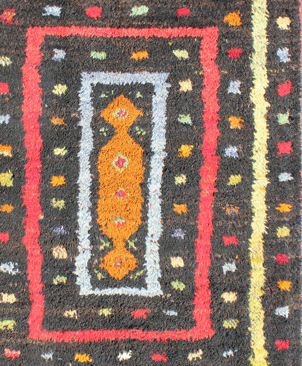 Vintage Turkish Tulu Rug with Tribal Pattern in Black, Yellow, Red, Blue and Red. Keivan Woven Arts / rug EN - 142568, country of origin / type: Turkey / Tulu, circa mid - 20th century Measures: 3'11 x 5'11. This vintage Tulu from mid - 20th century Tu... - Keivan Woven ArtsEN - 142568 - 7859Rug