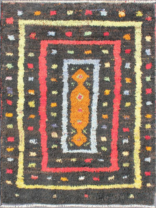 Vintage Turkish Tulu Rug with Tribal Pattern in Black, Yellow, Red, Blue and Red. Keivan Woven Arts / rug EN - 142568, country of origin / type: Turkey / Tulu, circa mid - 20th century Measures: 3'11 x 5'11. This vintage Tulu from mid - 20th century Tu... - Keivan Woven ArtsEN - 142568 - 7859Rug