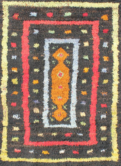 Vintage Turkish Tulu Rug with Tribal Pattern in Black, Yellow, Red, Blue and Red. Keivan Woven Arts / rug EN - 142568, country of origin / type: Turkey / Tulu, circa mid - 20th century Measures: 3'11 x 5'11. This vintage Tulu from mid - 20th century Tu... - Keivan Woven ArtsEN - 142568 - 7859Rug