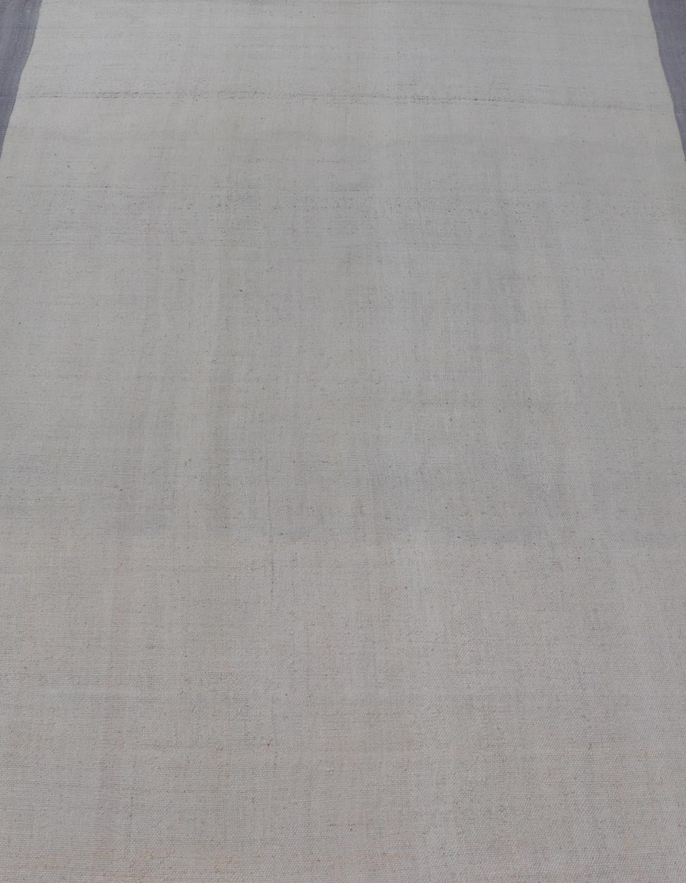 Vintage Turkish Kilim with Modern Design in Cream and Lavender Measures: 5'1 x 7'4 This piece, although vintage, is perfect for modern interiors, with minimalism on the high rise of today's trends. The face is plain, relying on the craf... - Keivan Woven ArtsEN - 142638 - 19130Rug