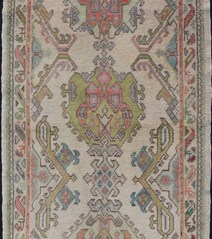 Measures: 2'10 x 5'8 Layered Medallion Vintage Turkish Area Rug Oushak with Geometric Motifs. Country of origin: Turkey; type: Oushak; design: Medallion; Keivan Woven Arts: rug EN - 14495; Layered medallion antique Turkish Oushak rug sub - geometric mo... - Keivan Woven ArtsEN - 14495 - 22782Rug