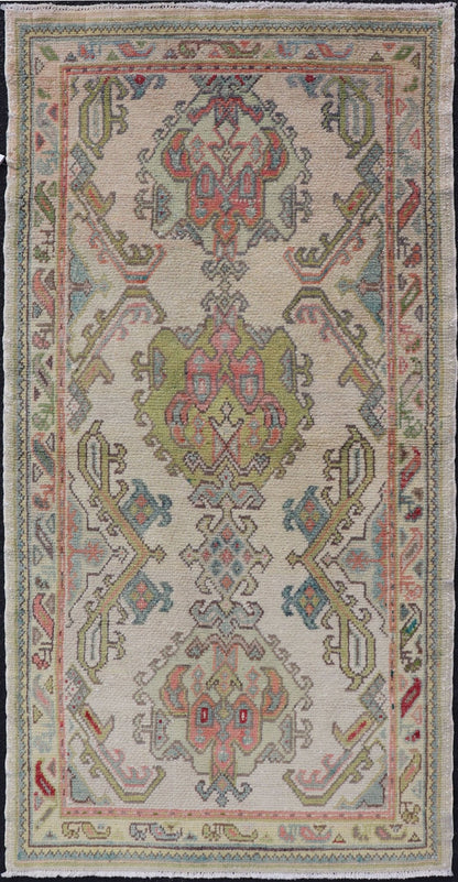 Measures: 2'10 x 5'8 Layered Medallion Vintage Turkish Area Rug Oushak with Geometric Motifs. Country of origin: Turkey; type: Oushak; design: Medallion; Keivan Woven Arts: rug EN - 14495; Layered medallion antique Turkish Oushak rug sub - geometric mo... - Keivan Woven ArtsEN - 14495 - 22782Rug