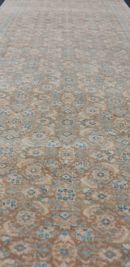 Measures: 3'4 x 11'0 Vintage Persian Tabriz Runner with All - Over Floral Design in Tan and Blue. Keivan Woven Arts / rug EN - 14502, country of origin/ type: Iran / Tabriz, circa 1950 This Persian runner with a sophisticated, all - over design fe... - Keivan Woven ArtsEN - 14502 - 23042Rug