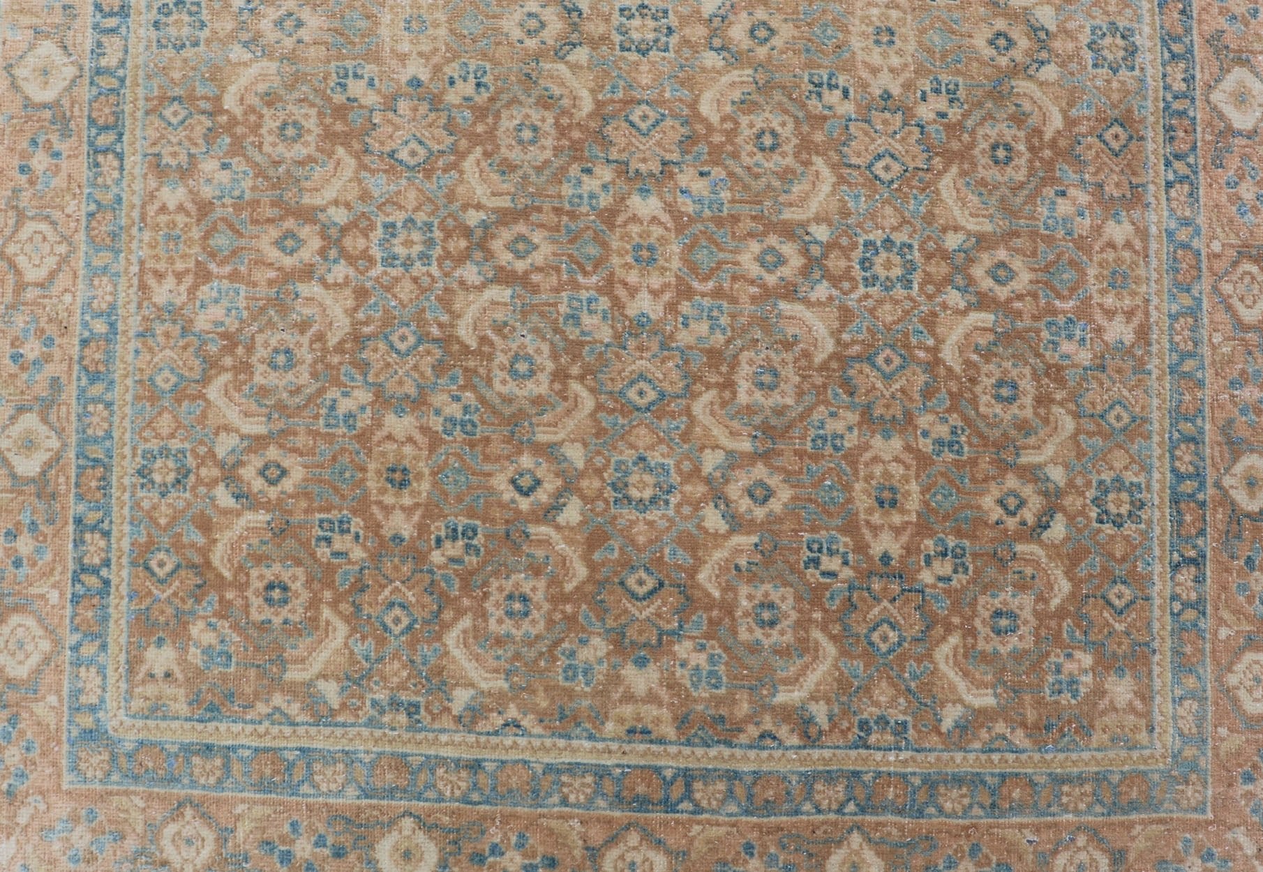 Measures: 3'4 x 11'0 Vintage Persian Tabriz Runner with All - Over Floral Design in Tan and Blue. Keivan Woven Arts / rug EN - 14502, country of origin/ type: Iran / Tabriz, circa 1950 This Persian runner with a sophisticated, all - over design fe... - Keivan Woven ArtsEN - 14502 - 23042Rug