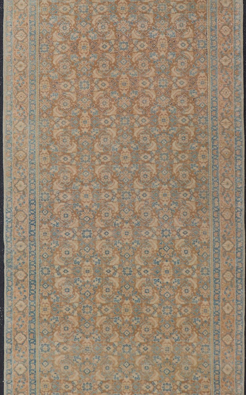 Measures: 3'4 x 11'0 Vintage Persian Tabriz Runner with All - Over Floral Design in Tan and Blue. Keivan Woven Arts / rug EN - 14502, country of origin/ type: Iran / Tabriz, circa 1950 This Persian runner with a sophisticated, all - over design fe... - Keivan Woven ArtsEN - 14502 - 23042Rug