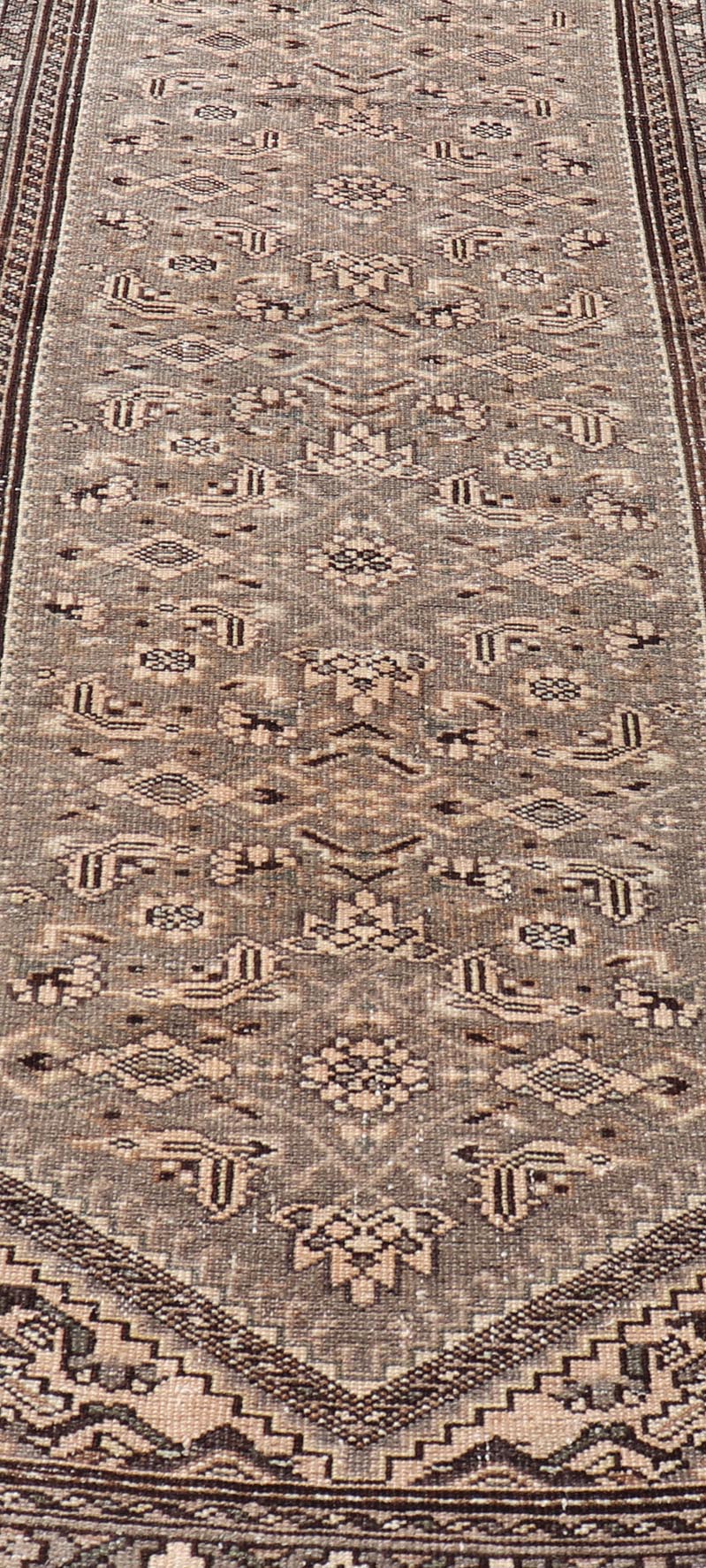 Measures: 2'11 x 9'4 Vintage Persian Hamadan Runner in Warm Tones of Grey, Brown and Taupe. Country of Origin: Iran; Type: Hamedan; Design: Floral, Persian Floral, All - Over; Keivan Woven Arts: rug EN - 14506. This vintage Persian runner featur... - Keivan Woven ArtsEN - 14506 - 18686Rug