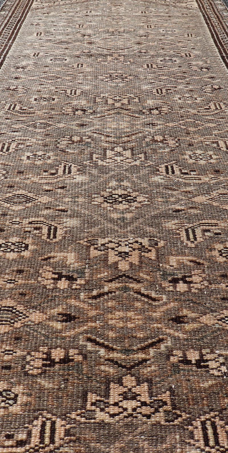 Measures: 2'11 x 9'4 Vintage Persian Hamadan Runner in Warm Tones of Grey, Brown and Taupe. Country of Origin: Iran; Type: Hamedan; Design: Floral, Persian Floral, All - Over; Keivan Woven Arts: rug EN - 14506. This vintage Persian runner featur... - Keivan Woven ArtsEN - 14506 - 18686Rug