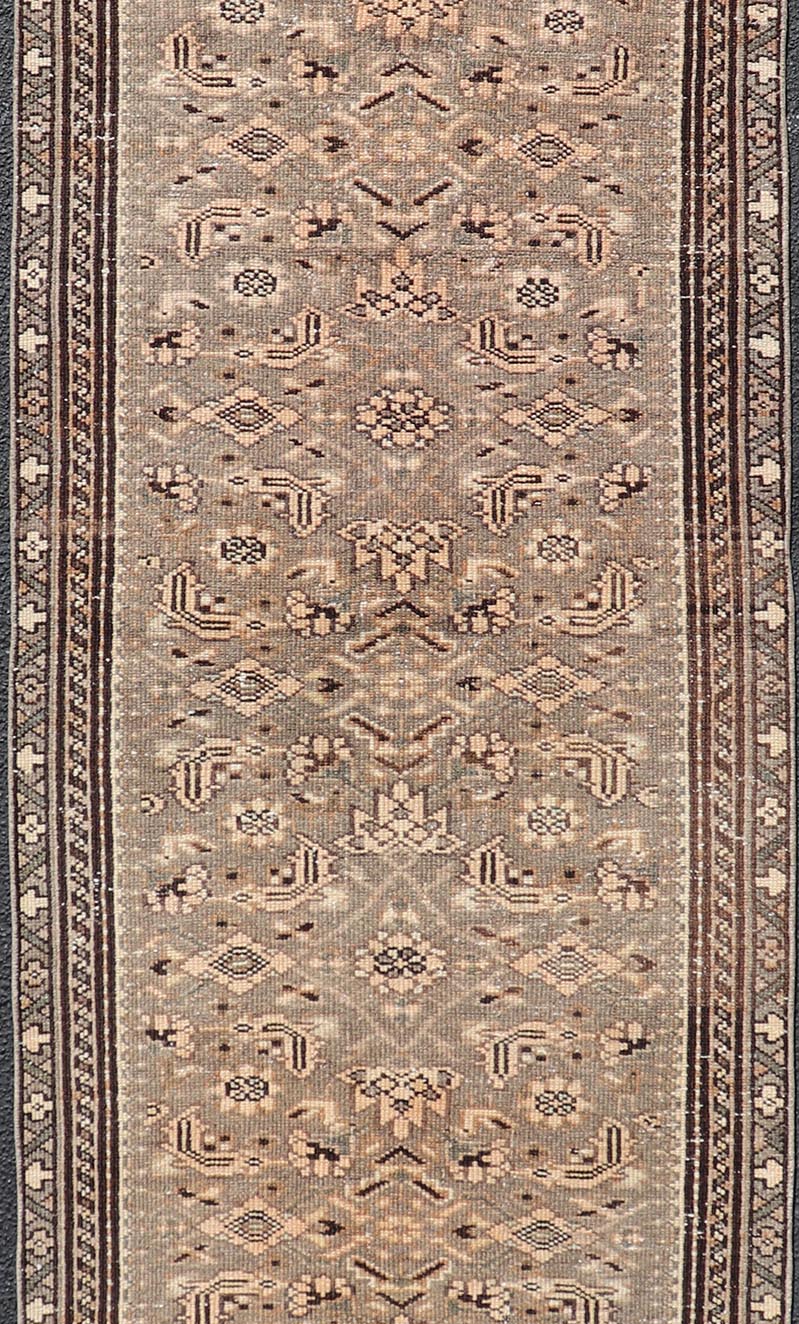 Measures: 2'11 x 9'4 Vintage Persian Hamadan Runner in Warm Tones of Grey, Brown and Taupe. Country of Origin: Iran; Type: Hamedan; Design: Floral, Persian Floral, All - Over; Keivan Woven Arts: rug EN - 14506. This vintage Persian runner featur... - Keivan Woven ArtsEN - 14506 - 18686Rug
